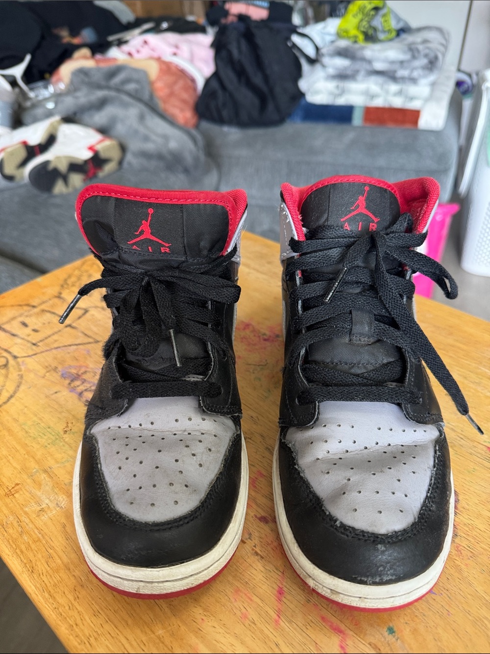 Air Jordan 1s Black and Grey Retro High-Top Sneakers with Red Trim